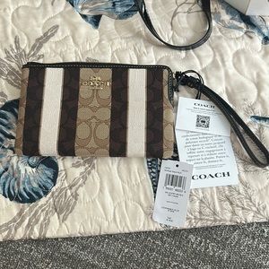 Coach Multi pattern Wristlet Brand new